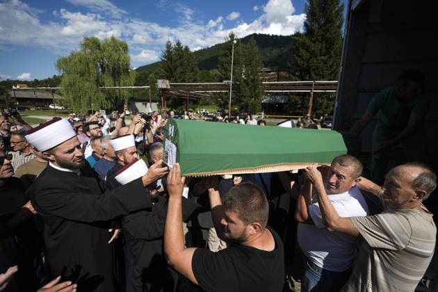 Column with the coffins of ten victims of the Srebrenica genocide has arrived in Potocari POTOCARI, BOSNIA AND HERZEGOVINA - JULY 09: People carry coffins containing the remains of victims of the 1995 Srebrenica genocide upon their arrival at the Memorial Center as family members and friends gather at the former Battery Factory to pay their respects to those who will be laid to rest during a collective funeral on July 11 in Potocari, Bosnia and Herzegovina, on July 09, 2026. Samir Jordamovic Anadolu Potocari Bosnia and Herzegovina. Editorial use only. Please get in touch for any other usage.  Copyright: x2026xAnadoluxSamirxJordamovicx