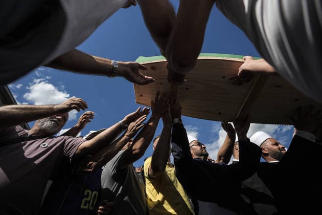 Column with the coffins of ten victims of the Srebrenica genocide has arrived in Potocari POTOCARI, BOSNIA AND HERZEGOVINA - JULY 09: People carry coffins containing the remains of victims of the 1995 Srebrenica genocide upon their arrival at the Memorial Center as family members and friends gather at the former Battery Factory to pay their respects to those who will be laid to rest during a collective funeral on July 11 in Potocari, Bosnia and Herzegovina, on July 09, 2026. Samir Jordamovic Anadolu Potocari Bosnia and Herzegovina. Editorial use only. Please get in touch for any other usage.  Copyright: x2026xAnadoluxSamirxJordamovicx