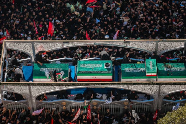 July 9, 2026, Mashhad, Razavi Khorasan, Iran: Crowds of mourners surround the convoy carrying the coffins of Iran s slain supreme leader Ali Khamenei and members of his family during a funeral procession, before he is buried at the Shrine of Imam Reza, Iran s most revered place of worship, in Mashhad on July 9, 2026. Braving sweltering heat and calling for revenge, Iranians loyal to the Islamic Republic massed on July 9 for the burial of slain supreme leader Ali Khamenei in his hometown of Mashhad. Khamenei will be buried in his hometown of Mashhad, home to the shrine of Imam Reza, Iran s holiest Shia Muslim site, following several days of ceremonies and processions across the country. Mashhad Iran - ZUMAi98_ 20260709_zih_i98_013 Copyright: xIranianxSupremexLeader SxOfficex