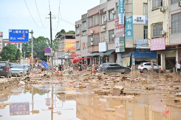 GUIGANG, CHINA - JULY 09: Residents clear silt and debris after floodwater recedes on July 9, 2026 in Guigang, Guangxi Zhuang Autonomous Region of China. Recent extreme rainstorms triggered by Typhoon Maysak, the 10th typhoon of the year, have caused severe flooding in parts of Guangxi in the Pearl River basin. Guangxi is continuing its search and rescue operations for missing persons, enhancing resettlement services for affected residents and advancing post-disaster reconstruction.  Copyright: xChinaxNewsxServicex 111653305524