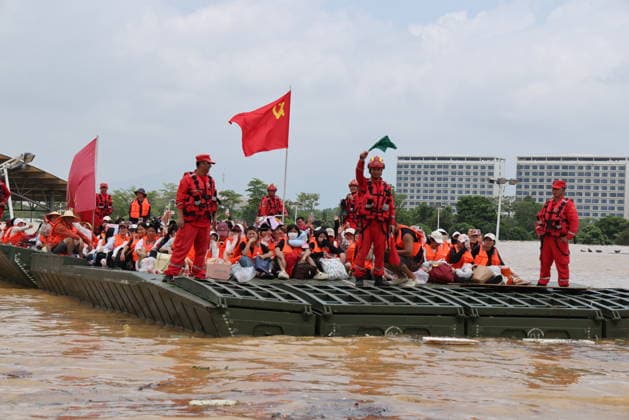 GUIGANG, CHINA - JULY 09: Rescuers evacuate trapped students on July 9, 2026 in Guigang, Guangxi Zhuang Autonomous Region of China. Recent extreme rainstorms triggered by Typhoon Maysak, the 10th typhoon of the year, have caused severe flooding in parts of Guangxi in the Pearl River basin. Guangxi is continuing its search and rescue operations for missing persons, enhancing resettlement services for affected residents and advancing post-disaster reconstruction.  Copyright: xVCGx 111653352919