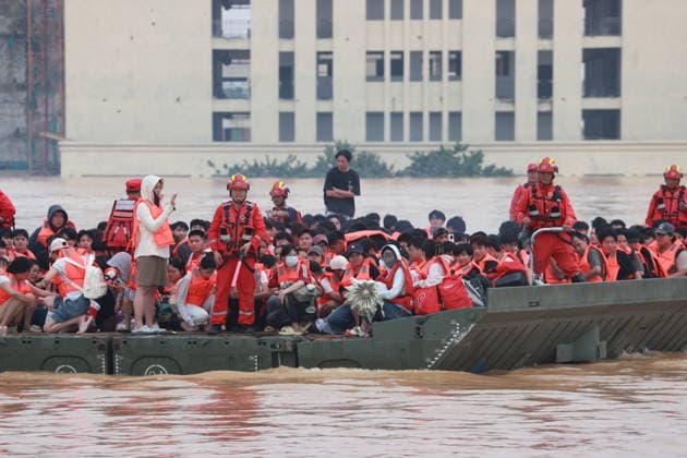 GUIGANG, CHINA - JULY 09: Rescuers evacuate trapped students on July 9, 2026 in Guigang, Guangxi Zhuang Autonomous Region of China. Recent extreme rainstorms triggered by Typhoon Maysak, the 10th typhoon of the year, have caused severe flooding in parts of Guangxi in the Pearl River basin. Guangxi is continuing its search and rescue operations for missing persons, enhancing resettlement services for affected residents and advancing post-disaster reconstruction.  Copyright: xVCGx 111653352907