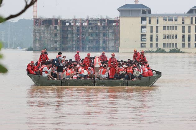 GUIGANG, CHINA - JULY 09: Rescuers evacuate trapped students on July 9, 2026 in Guigang, Guangxi Zhuang Autonomous Region of China. Recent extreme rainstorms triggered by Typhoon Maysak, the 10th typhoon of the year, have caused severe flooding in parts of Guangxi in the Pearl River basin. Guangxi is continuing its search and rescue operations for missing persons, enhancing resettlement services for affected residents and advancing post-disaster reconstruction.  Copyright: xVCGx 111653352908