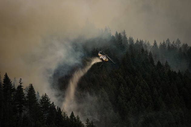 July 9, 2026, Boston Bar, Bc, CANADA: A helicopter drops water while fighting the Brunswick Creek wildfire in Boston Bar, B.C., on Thursday, July 9, 2026. Boston Bar CANADA  - ZUMAc35_ 20260709_zaf_c35_070 Copyright: xDarrylxDyckx