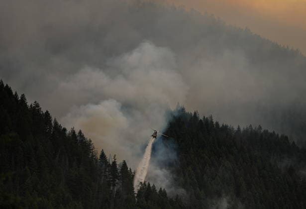 July 9, 2026, Boston Bar, Bc, CANADA: A helicopter drops water while fighting the Brunswick Creek wildfire in Boston Bar, B.C., on Thursday, July 9, 2026. Boston Bar CANADA  - ZUMAc35_ 20260709_zaf_c35_072 Copyright: xDarrylxDyckx