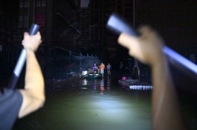 (260710) -- GUIGANG, July 10, 2026 -- Rescuers deliver supplies to stranded residents in Guigang, south China s Guangxi Zhuang Autonomous Region, July 9, 2026. Guigang has suffered severe flooding due to torrential rains brought by Typhoon Maysak and upstream inflows. Local authorities have mobilized rescue forces to work around the clock, making every effort to ensure basic living needs for stranded residents. ) CHINA-GUANGXI-GUIGANG-TYPHOON-FLOOD-RESCUE (CN) ZhouxHua 