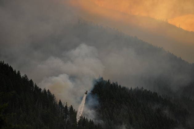 July 9, 2026, Boston Bar, Bc, CANADA: A helicopter drops water while fighting the Brunswick Creek wildfire in Boston Bar, B.C., on Thursday, July 9, 2026. Boston Bar CANADA  - ZUMAc35_ 20260709_zaf_c35_086 Copyright: xDarrylxDyckx