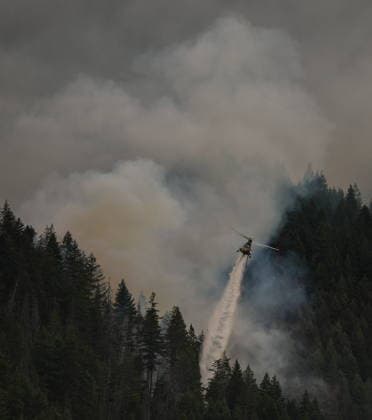 July 9, 2026, Boston Bar, Bc, CANADA: A helicopter drops water while fighting the Brunswick Creek wildfire in Boston Bar, B.C., on Thursday, July 9, 2026. Boston Bar CANADA  - ZUMAc35_ 20260709_zaf_c35_088 Copyright: xDarrylxDyckx