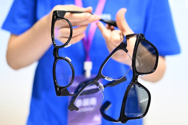 2026 AI Terminal Industry Expo NANJING, CHINA - JULY 10, 2026 - A staff member showcased smart glasses at the Qwen AI Glasses booth at the 2026 Artificial Intelligence Terminal Industry Expo in Nanjing, Jiangsu Province, China on July 10, 2026. Nanjing Jiangsu China  Copyright: xCFOTOx i1783688702751
