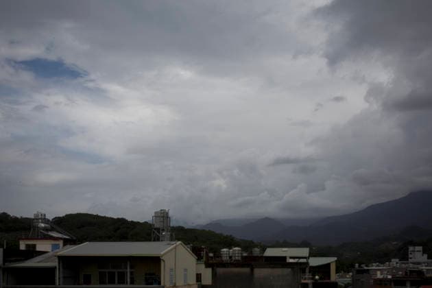 July 10, 2026, Taichung, Taiwan: Dark clouds over mountain and buildings on the outskirts of Taichung, Taiwan. The Central Weather Administration (CWA) has issued a land warning for Typhoon Bavi. Rainfall is expected to increase in mountainous areas of northern, central and southern Taiwan later in the day, with the heaviest precipitation forecast from Friday night through Saturday. Taichung Taiwan  - ZUMAc217 20260710_zip_c217_002 Copyright: xAndrexM.xChangx