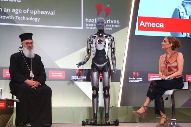 July 10, 2026, Athens, Greece: AMECA robot speaks with one philosopher and one preast at 30th Annual Government Roundtable Economist conference. Ameca is the worldÃ¢â‚¬â ¢s leading social humanoid robot, created by UK robotics company Engineered Arts. First unveiled in 2021, Ameca was designed for advanced, natural and engaging human-robot interaction, combining artificial intelligence, expressive and realistic facial movements, and lifelike gestures. Athens Greece - ZUMAv62_ 20260710_zaf_v62_005 Copyright: xAristidisxVafeiadakisx