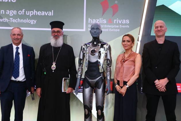 July 10, 2026, Athens, Greece: AMECA robot speaks with one philosopher and one preast at 30th Annual Government Roundtable Economist conference. Ameca is the worldÃ¢â‚¬â ¢s leading social humanoid robot, created by UK robotics company Engineered Arts. First unveiled in 2021, Ameca was designed for advanced, natural and engaging human-robot interaction, combining artificial intelligence, expressive and realistic facial movements, and lifelike gestures. Athens Greece  - ZUMAv62_ 20260710_zaf_v62_013 Copyright: xAristidisxVafeiadakisx