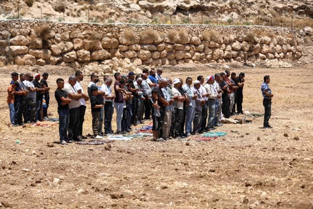 Israeli settlers prevented Palestinian farmers from accessing their agricultural lands in Hebron HEBRON, WEST BANK, PALESTINE - JULY 10: Palestinians perform Friday prayers on land threatened with confiscation by Israel while Israeli settlers, protected by Israeli forces, continue to block roads leading to Palestinian farmers lands in the town of Izna, near Hebron, West Bank, Palestine on July 10, 2026. Wisam Hashlamoun Anadolu Hebron West Bank. Editorial use only. Please get in touch for any other usage.  Copyright: x2026xAnadoluxWisamxHashlamounx