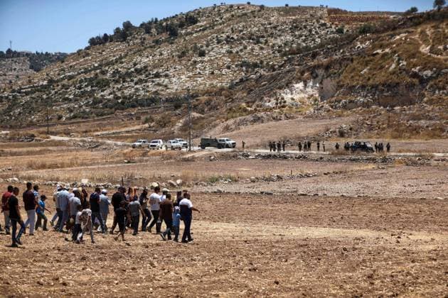 Israeli settlers prevented Palestinian farmers from accessing their agricultural lands in Hebron HEBRON, WEST BANK, PALESTINE - JULY 10: Palestinians are seen after performing Friday prayers on land threatened with confiscation by Israel while Israeli settlers, protected by Israeli forces, continue to block roads leading to Palestinian farmers lands in the town of Izna, near Hebron, West Bank, Palestine on July 10, 2026. Wisam Hashlamoun Anadolu Hebron West Bank. Editorial use only. Please get in touch for any other usage.  Copyright: x2026xAnadoluxWisamxHashlamounx