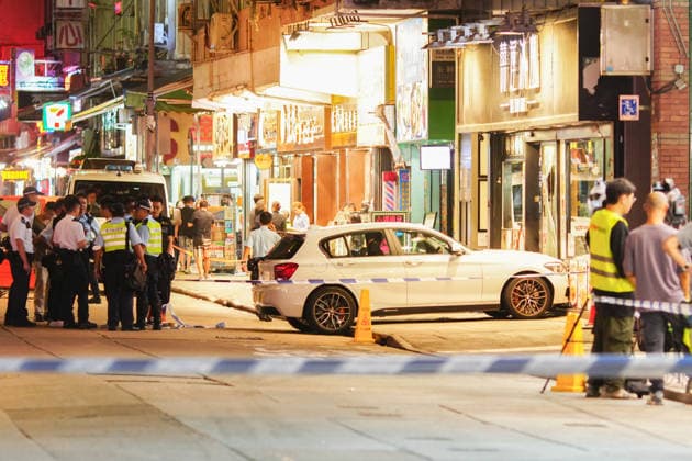 HONG KONG-DAILY MONGKOK-CAR-CRASH A general view from outside the police cordon shows a white private car that crashed into a cafe at the intersection of Portland Street and Shantung Street following a police chase in Mong Kok on July 10, 2026 in Hong Kong. Police arrested two men and seized suspected drugs from the vehicle after it rammed onto the pavement while evading an intercept. (Photo by Zulu Lo TMHK via Nexpher Images) Hong Kong