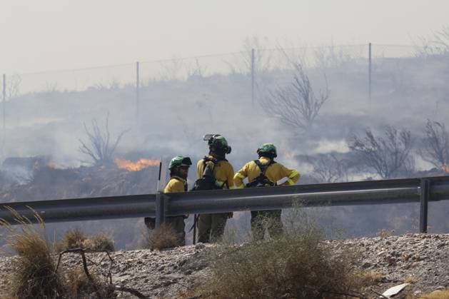 Forest fire kills at least 12 in southern Spain ALMERIA, SPAIN - JULY 10: Three firefighters stand behind a guardrail monitoring the advance of flames during a massive wildfire while evacuation and firefighting efforts continue in the Los Gallardos district of Almeria, Spain on July 10, 2026. At least 12 people were killed in a forest fire that broke out Thursday in Los Gallardos municipality in Almeria province in Spain’s southern Andalusia region, broadcaster RTVE reported. According to Andalusia’s emergency services, the victims were found in a hamlet of the neighboring municipality of Bedar, with some discovered inside vehicles engulfed by the flames. Pablo Miranzo Anadolu Almeria Spain. Editorial use only. Please get in touch for any  Copyright: x2026xAnadoluxPabloxMiranzox