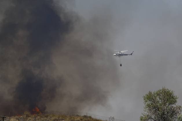 Forest fire kills at least 12 in southern Spain ALMERIA, SPAIN - JULY 10: A firefighting helicopter flies through a dense smoke-filled sky during emergency operations to contain a massive wildfire while evacuation and firefighting efforts continue in the Los Gallardos district of Almeria, Spain on July 10, 2026. At least 12 people were killed in a forest fire that broke out Thursday in Los Gallardos municipality in Almeria province in Spain’s southern Andalusia region, broadcaster RTVE reported. According to Andalusia’s emergency services, the victims were found in a hamlet of the neighboring municipality of Bedar, with some discovered inside vehicles engulfed by the flames. Pablo Miranzo Anadolu Almeria Spain. Editorial use only. Please  Copyright: x2026xAnadoluxPabloxMiranzox
