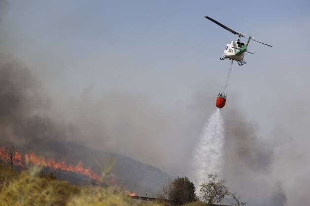 Forest fire kills at least 12 in southern Spain ALMERIA, SPAIN - JULY 10: A firefighting helicopter releases its water load over heavy smoke during emergency operations to contain a massive wildfire while evacuation and firefighting efforts continue in the Los Gallardos district of Almeria, Spain on July 10, 2026. At least 12 people were killed in a forest fire that broke out Thursday in Los Gallardos municipality in Almeria province in Spain’s southern Andalusia region, broadcaster RTVE reported. According to Andalusia’s emergency services, the victims were found in a hamlet of the neighboring municipality of Bedar, with some discovered inside vehicles engulfed by the flames. Pablo Miranzo Anadolu Almeria Spain. Editorial use only. Pleas  Copyright: x2026xAnadoluxPabloxMiranzox