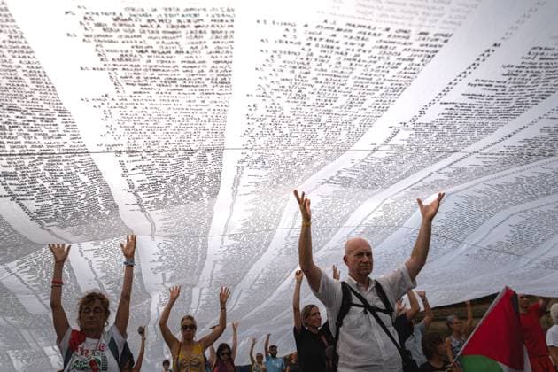 ITALY-GAZA PROTEST CESENA, ITALY, JULY 10, 2026 Participants march beneath a giant white shroud covered with the names of 18,457 Palestinian children killed in Gaza since October 2023 during the Shroud for Gaza demonstration in Cesena, northern Italy. The memorial installation is part of a travelling national initiative that has crossed several Italian cities to honour the victims of the war and draw attention to the humanitarian consequences of the conflict. (Silvia Casadei JNA Press) Cesena Italy Copyright: x xSilviaxCasadeix xJNAxPressx