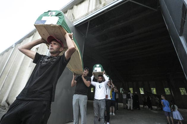 Coffins brought to Musalla in Potocari: The last farewell to the victims of the genocide in Srebrenica SREBRENICA, BOSNIA AND HERZEGOVINA - JULY 10: Family members of the victims and Peace March participants carry coffins containing the remains of ten Srebrenica genocide victims from the former Battery Factory to the Musalla area at the Potocari Memorial Center Cemetery in Srebrenica, Bosnia and Herzegovina, on July 10, 2026. Relatives and participants gathered with prayers and tears ahead of tomorrow s collective funeral and burial on the 31st anniversary of the 1995 genocide. Samir Jordamovic Anadolu Srebrenica Bosnia and Herzegovina. Editorial use only. Please get in touch for any other usage.  Copyright: x2026xAnadoluxSamirxJordamovicx