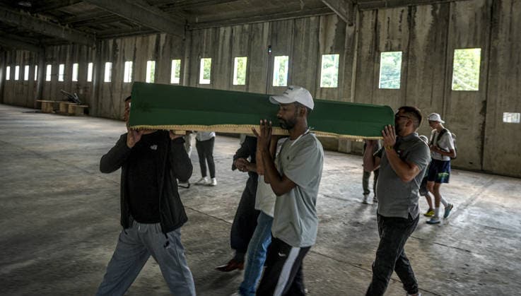 Coffins brought to Musalla in Potocari: The last farewell to the victims of the genocide in Srebrenica SREBRENICA, BOSNIA AND HERZEGOVINA - JULY 10: Family members of the victims and Peace March participants carry coffins containing the remains of ten Srebrenica genocide victims from the former Battery Factory to the Musalla area at the Potocari Memorial Center Cemetery in Srebrenica, Bosnia and Herzegovina, on July 10, 2026. Relatives and participants gathered with prayers and tears ahead of tomorrow s collective funeral and burial on the 31st anniversary of the 1995 genocide. Samir Jordamovic Anadolu Srebrenica Bosnia and Herzegovina. Editorial use only. Please get in touch for any other usage.  Copyright: x2026xAnadoluxSamirxJordamovicx