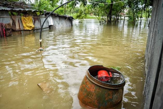 July 10, 2026, Banshkhali, Bangladesh: BANSHKHALI, CHATTOGRAM, BANGLADESH Ã¢â‚¬ JULY 10, 2026: Residents wade through floodwaters and evacuate children and belongings after days of heavy monsoon rainfall, runoff from surrounding hills and high tides caused severe flooding in Banshkhali Upazila, Chattogram. Hundreds of homes, roads and agricultural land have been inundated, leaving many families stranded and increasing concerns over access to shelter, clean water and essential services. Authorities and local volunteers continue to monitor the situation as affected residents wait for floodwaters to recede. Photos by JNA PRESS. Banshkhali Bangladesh  - ZUMAq101 20260710_zna_q101_064 Copyright: xIstiyakxAhamedxSrabonx