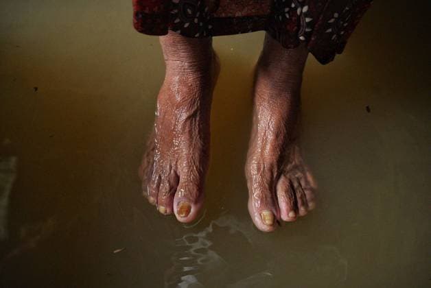 July 10, 2026, Banshkhali, Bangladesh: BANSHKHALI, CHATTOGRAM, BANGLADESH Ã¢â‚¬ JULY 10, 2026: Residents wade through floodwaters and evacuate children and belongings after days of heavy monsoon rainfall, runoff from surrounding hills and high tides caused severe flooding in Banshkhali Upazila, Chattogram. Hundreds of homes, roads and agricultural land have been inundated, leaving many families stranded and increasing concerns over access to shelter, clean water and essential services. Authorities and local volunteers continue to monitor the situation as affected residents wait for floodwaters to recede. Photos by JNA PRESS. Banshkhali Bangladesh  - ZUMAq101 20260710_zna_q101_067 Copyright: xIstiyakxAhamedxSrabonx