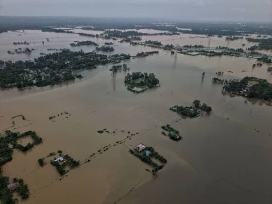 July 10, 2026, Banshkhali, Bangladesh: BANSHKHALI, CHATTOGRAM, BANGLADESH Ã¢â‚¬ JULY 10, 2026: Residents wade through floodwaters and evacuate children and belongings after days of heavy monsoon rainfall, runoff from surrounding hills and high tides caused severe flooding in Banshkhali Upazila, Chattogram. Hundreds of homes, roads and agricultural land have been inundated, leaving many families stranded and increasing concerns over access to shelter, clean water and essential services. Authorities and local volunteers continue to monitor the situation as affected residents wait for floodwaters to recede. Photos by JNA PRESS. Banshkhali Bangladesh  - ZUMAq101 20260710_zna_q101_074 Copyright: xIstiyakxAhamedxSrabonx