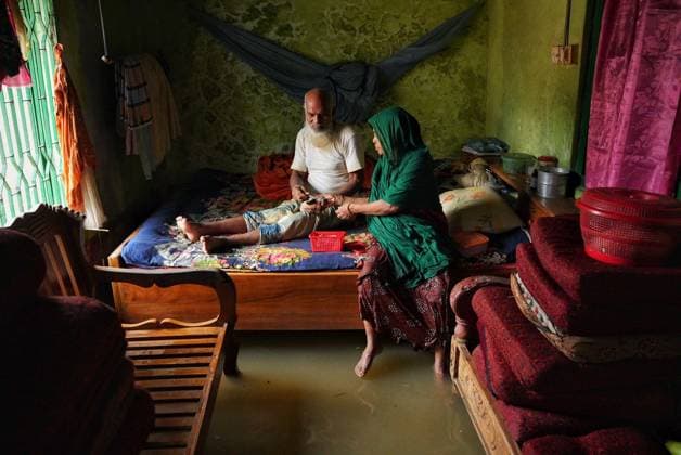 July 10, 2026, Banshkhali, Bangladesh: BANSHKHALI, CHATTOGRAM, BANGLADESH Ã¢â‚¬ JULY 10, 2026: Residents wade through floodwaters and evacuate children and belongings after days of heavy monsoon rainfall, runoff from surrounding hills and high tides caused severe flooding in Banshkhali Upazila, Chattogram. Hundreds of homes, roads and agricultural land have been inundated, leaving many families stranded and increasing concerns over access to shelter, clean water and essential services. Authorities and local volunteers continue to monitor the situation as affected residents wait for floodwaters to recede. Photos by JNA PRESS. Banshkhali Bangladesh  - ZUMAq101 20260710_zna_q101_088 Copyright: xIstiyakxAhamedxSrabonx