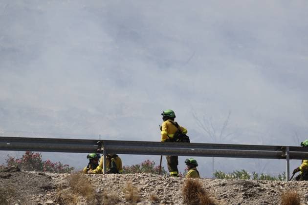 July 10, 2026, Almeria, ES: ALMERIA, SPAIN - JULY 10: Emergency personnel navigate through dry brush and steep terrain while monitoring a massive wildfire in Los Gallardos, Almeria province, southern Spain, on July 10, 2026. This disaster represents the most severe fire event in the history of Andalusia, resulting in twelve confirmed fatalities, twenty-three individuals missing, and the urgent evacuation of six hundred citizens, with emergency relief teams coordinating temporary housing from the nearby town of Garrucha. Stinger Jna press Almeria ES  - ZUMAq101 20260710_zna_q101_105 Copyright: xEditorx