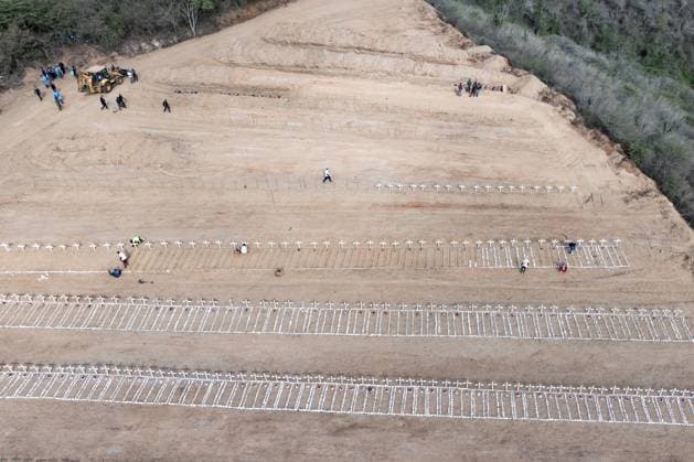 Emergency cemetery opens in Venezuela after deadly earthquakes LA GUAIRA, VENEZUELA - JULY 10: An aerial view of the mass grave at the La Esperanza Cemetery located along the highway connecting Catia La Mar and Carayaca, as it was opened under emergency measures following the June 24 earthquakes to bury the bodies of hundreds of people whose relatives could not be reached, in La Guaira, Venezuela on July 10, 2026. Alongside identified victims, hundreds of unidentified bodies were also laid to rest at the cemetery. Cem Tekkesinoglu Anadolu La Guaira Venezuela. Editorial use only. Please get in touch for any other usage.  Copyright: x2026xAnadoluxCemxTekkesinoglux
