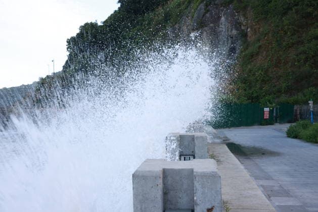 CANGNAN, CHINA - JULY 10: Waves crash near Jinsha Beach on July 10, 2026 in Cangnan, Zhejiang Province of China. As Typhoon Bavi approaches, local authorities have advanced typhoon defense preparations in Yanting Town. The 670-meter seawall at Jinsha Beach features a modular design combining removable barriers with tempered glass walls to withstand wave impact.  Copyright: xChinaxNewsxServicex 111653534187