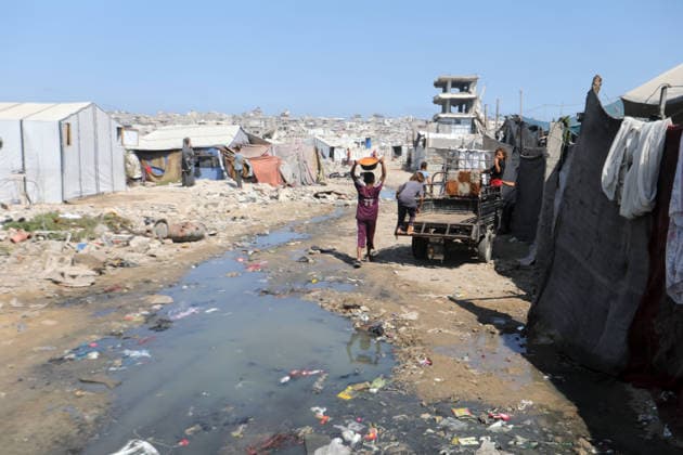 Displaced Palestinians endure harsh living conditions in eastern Gaza City Displaced Palestinians struggle to continue their daily lives inside worn-out tents erected near buildings destroyed by the war in the al-Zarqa area, east of Gaza City, on July 11, 2026. The scene coincides with World Population Day as displaced families continue to face shortages of water and food, deteriorating sanitation and healthcare services, and the widespread collapse of essential infrastructure amid the ongoing impact of the war. Photo by Bilal Osama apaimages Gaza city Gaza Strip Palestinian Territory 110726_Gaza_BO_00(18) Copyright: xapaimagesxBilalxOsamax xapaimagesx