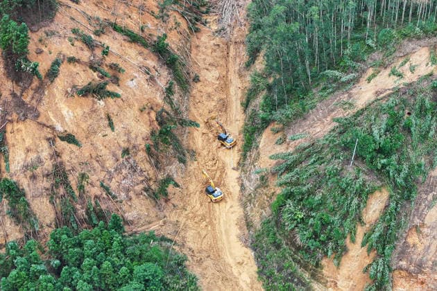 (260711) -- HENGZHOU, July 11, 2026 -- An aerial drone photo taken on July 11, 2026 shows rescuers clearing up a road leading to Zhenlong Township in Hengzhou, south China s Guangxi Zhuang Autonomous Region. One main road leading to the government seat of Zhenlong Township in the city of Hengzhou, south China s Guangxi Zhuang Autonomous Region, was preliminarily opened to traffic at around 1:30 p.m. on Saturday, Xinhua reporters at the rescue site have confirmed. With a permanent population of about 8,000, the township had been trapped as an isolated island. Hit by continuous heavy rainfall, the entire township was cut off from outside access with no open roads, power or network services starting from July 5. The opening of the mai 