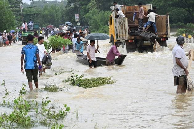 July 11, 2026, Satkania, Chattogram, Bangladesh: July 11, 2026, Satkania, Chattogram, Bangladesh: Residents use carts and boats to cross flooded roads as severe floods and landslides hit Chattogram Division. At least 39 people have died and more than 928,000 are affected across five districts. Thousands remain stranded amid shortages of food, safe water and medicines as rescue and relief operations continue. Satkania Bangladesh - ZUMAh178 20260711_zip_h178_025 Copyright: xMuhammadxAmdadxHossainx