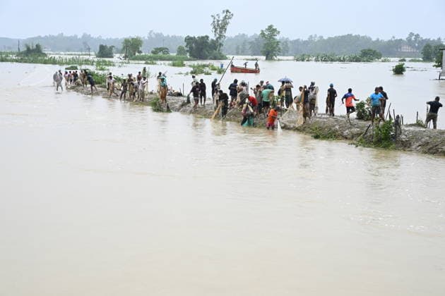 July 11, 2026, Satkania, Chattogram, Bangladesh: July 11, 2026, Satkania, Chattogram, Bangladesh: Residents use fishing nets in widespread floodwaters after days of relentless rainfall inundated communities across Satkania, Chattogram, Bangladesh on July 11, 2026. At least 39 people have died and more than 928,000 have been affected across five districts in Chattogram Division. Satkania Bangladesh - ZUMAh178 20260711_zip_h178_027 Copyright: xMuhammadxAmdadxHossainx