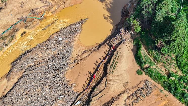 (260711) -- NANNING, July 11, 2026 -- An aerial drone photo shows rescuers heading towards Zhenlong Township of Hengzhou, south China s Guangxi Zhuang Autonomous Region, July 11, 2026. Triggered by Typhoon Maysak, the tenth typhoon of the year, heavy downpours battered multiple areas in south China s Guangxi Zhuang Autonomous Region, resulting in a series of disasters. Various response forces have pooled their efforts, carrying out operations including rescue missions in remote mountainous areas, restoration of transport and power infrastructure, and silt clearing operations. ) CHINA-GUANGXI-TYPHOON-FLOOD-RESCUE (CN) HuangxXiaobang 