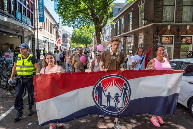 July 11, 2026, Schiedam, South Holland, Netherlands: 11 July 2026. Anti-asylum seeker center demonstrators march. In Schiedam, the Netherlands, a pro-asylum seeker demonstration promoted by Extinction Rebellion countered a demonstration called the Vrouwenmars tegen het AZC (Women s March Against the AZC) promoted by anti-asylum seeker centre groups. Both events took place in the center of Schiedam. Schiedam Netherlands - ZUMAp202 20260711_zip_p202_002 Copyright: xJamesxPetermeierx