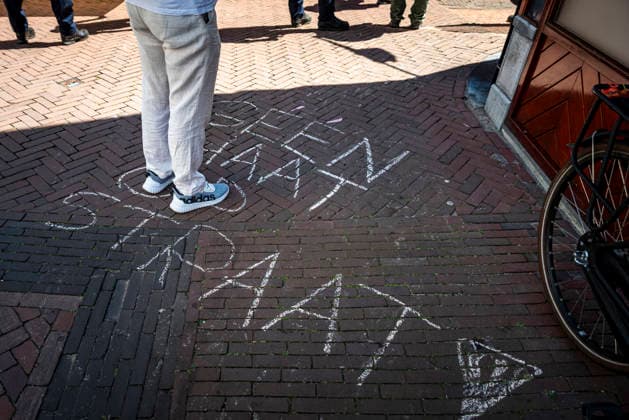 July 11, 2026, Schiedam, South Holland, Netherlands: 11 July 2026. Pro-asylum seeker demonstrators have written No Hate On The Street (translated from Dutch) along the route being marched by anti-asylum seeker demonstrators. In Schiedam, the Netherlands, a pro-asylum seeker demonstration promoted by Extinction Rebellion countered a demonstration called the Vrouwenmars tegen het AZC (Women s March Against the AZC) promoted by anti-asylum seeker centre groups. Both events took place in the center of Schiedam. Schiedam Netherlands - ZUMAp202 20260711_zip_p202_013 Copyright: xJamesxPetermeierx