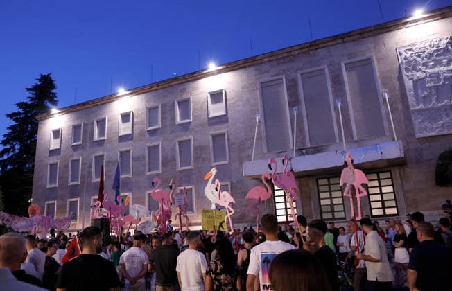 July 11, 2026, Tirane, Albania, ALB: Protesters hold signs and Albanian national flags as they take part in a demonstration in front of the PM office in Tirana on July 11, 2026, opposing the construction of a luxury resort in a protected natural area near the city of Vlore. Several thousand citizens demonstrated in Tirana for the 42nd consecutive night to demand transparency on a luxury tourism complex project in the protected area of Narta Lagoon in the city of Vlore linked to US President Donald Trump s son-in-law, Jared Kushner, and his wife, Ivanka Trump. The project was planned for two areas along the Adriatic coast: the protected delta area of Vjosa-Narta and the nearby uninhabited island of Sazan. Tirane ALB  - ZUMAs337 20260711_znp_s337_015 Copyright: xGentxShkullakux