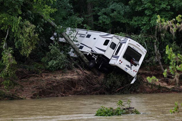 July 11, 2026, Lesterville, Mo, USA: A recreational vehicle is wedged between trees on the banks of the Black River after flash flooding caused water levels to rise and flood the campsite in Lesterville, Missouri, on Saturday, July 11, 2026. Lesterville USA  - ZUMAm67_ 20260711_zaf_m67_006 Copyright: xLizxRymarevx