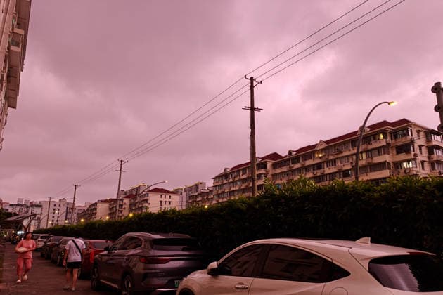 SHANGHAI, CHINA - JULY 11: The sky presents a rare dark red hue on July 11, 2026 in Shanghai, China. Typhoon Bavi, the ninth typhoon of the year, is expected to make landfall along the coast between Wenling and Rui an in east China s Zhejiang Province from the night of July 11 to early morning of July 12, according to the National Meteorological Center.  Copyright: xVCGx 111653702543
