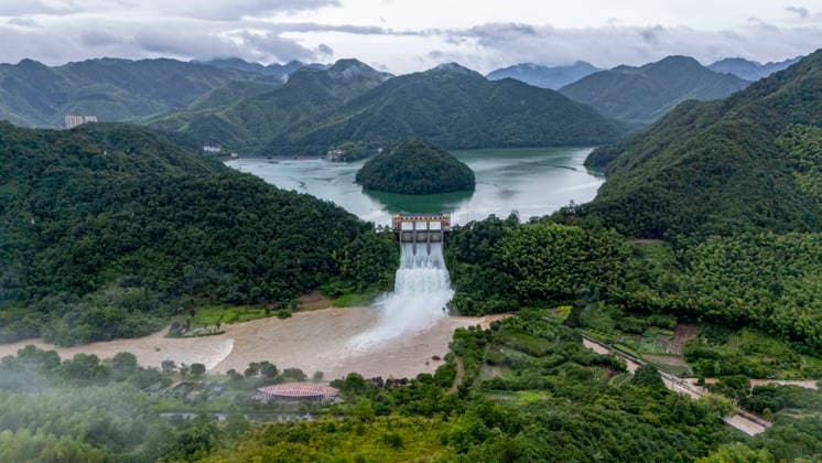 JINHUA, CHINA - JULY 12: In an aerial view, sluice gates of Andi Reservoir open to release flood water on July 12, 2026 in Jinhua, Zhejiang Province of China. Affected by Typhoon Bavi, Andi Reservoir in Jinhua recorded a water level of 125.71 meters on July 12, close to its flood threshold.  Copyright: xVCGx 111653805742