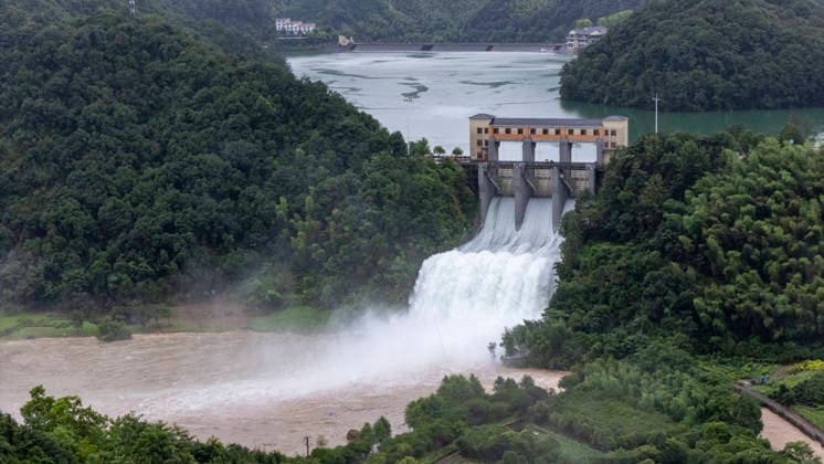 JINHUA, CHINA - JULY 12: In an aerial view, sluice gates of Andi Reservoir open to release flood water on July 12, 2026 in Jinhua, Zhejiang Province of China. Affected by Typhoon Bavi, Andi Reservoir in Jinhua recorded a water level of 125.71 meters on July 12, close to its flood threshold.  Copyright: xVCGx 111653805747