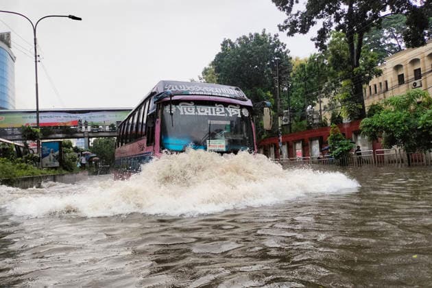July 12, 2026, Dhaka, Dhaka, Bangladesh: DHAKA, Bangladesh, July 12, 2026 Ã¢â‚¬ Overnight heavy rainfall triggered widespread waterlogging across Dhaka on Sunday, disrupting daily life and causing severe hardship for residents...Several low-lying areas of the capital were submerged under knee- to waist-deep water, forcing commuters, schoolchildren, office workers and daily wage earners to wade through flooded streets. In several neighborhoods, mothers were seen carrying their children, while parents guided students by hand through waterlogged roads...The persistent rainfall caused severe traffic congestion on major roads across the capital, leaving many commuters stranded for hours and delaying travel. According to local residents, inade  - ZUMAk185 20260712_zip_k185_008 Copyright: xRubelxKarmakerx
