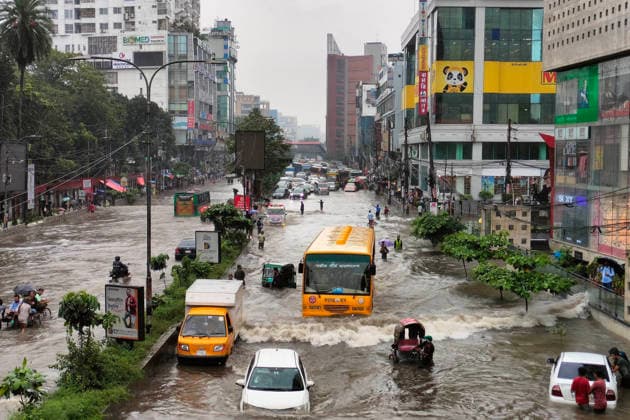 July 12, 2026, Dhaka, Dhaka, Bangladesh: DHAKA, Bangladesh, July 12, 2026 Ã¢â‚¬ Overnight heavy rainfall triggered widespread waterlogging across Dhaka on Sunday, disrupting daily life and causing severe hardship for residents...Several low-lying areas of the capital were submerged under knee- to waist-deep water, forcing commuters, schoolchildren, office workers and daily wage earners to wade through flooded streets. In several neighborhoods, mothers were seen carrying their children, while parents guided students by hand through waterlogged roads...The persistent rainfall caused severe traffic congestion on major roads across the capital, leaving many commuters stranded for hours and delaying travel. According to local residents, inade  - ZUMAk185 20260712_zip_k185_015 Copyright: xRubelxKarmakerx