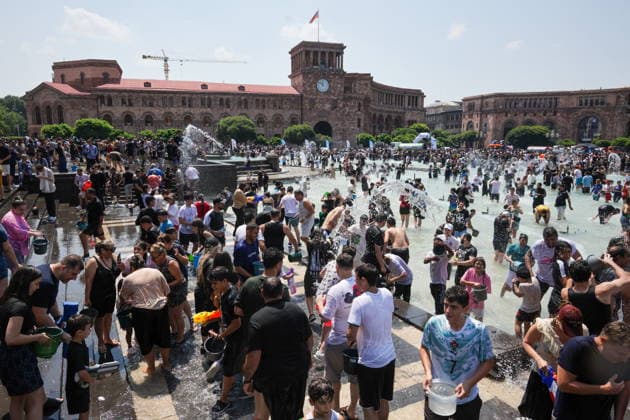 ARMENIA, YEREVAN - JULY 12, 2026: Citizens enjoy dousing each other in Republic Square during the traditional feast of Vardavar celebrated by the Armenian Apostolic Church to mark the Transfiguration of Christ Yerevan Armenia  - ZUMAt113 20260712_zaa_t113_145 Copyright: xAlexanderxPatrinx