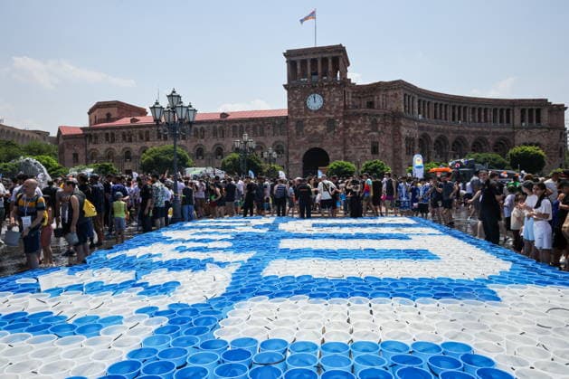 ARMENIA, YEREVAN - JULY 12, 2026: Buckets line up for citizens to douse each other in Republic Square during the traditional feast of Vardavar celebrated by the Armenian Apostolic Church to mark the Transfiguration of Christ Yerevan Armenia  - ZUMAt113 20260712_zaa_t113_168 Copyright: xAlexanderxPatrinx
