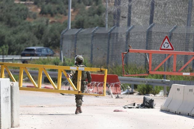 Palestinians protest Israeli military blockade at entrance of Azzun town in West Bank QALQILYA, WEST BANK, PALESTINE - JULY 12: Israeli forces take measures as Palestinians gather to protest against the ongoing closure of the entrance to Azzun town, located east of Qalqilya in the West Bank, Palestine on July 12, 2026. The Israeli military has kept the town s entrance blocked with military checkpoints and iron barricades since October 7, 2023, severely disrupting the daily lives of local residents. Issam Rimawi Anadolu Qalqilya West Bank. Editorial use only. Please get in touch for any other usage.  Copyright: x2026xAnadoluxIssamxRimawix