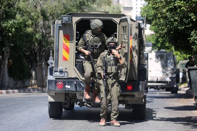 Israeli forces deploy during military operation in Nablus Israeli military vehicles and soldiers are deployed in the streets during a military operation targeting the West Bank city of Nablus, on July 12, 2026. Israeli forces raided several neighborhoods in the western part of the city during the operation. Photo by Mohammed Nasser apaimages Nablus West Bank Palestinian Territory 120726_Nablus_MN_00(14) Copyright: xapaimagesxMohammedxNasserx xapaimagesx